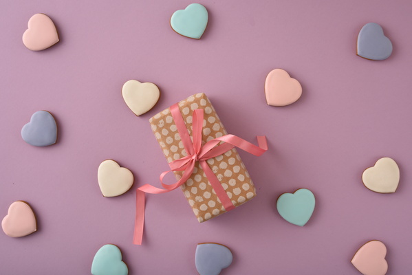 Gift and Some Multicolored Heart-Shaped Cookies